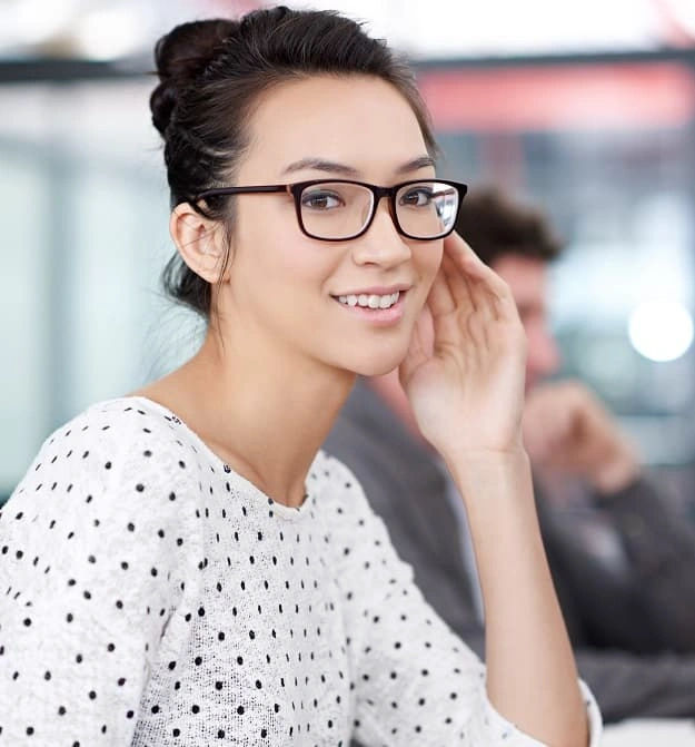 Female At Desk Smiling While Scheduling Invoice Reminders From Business Central In The Cloud