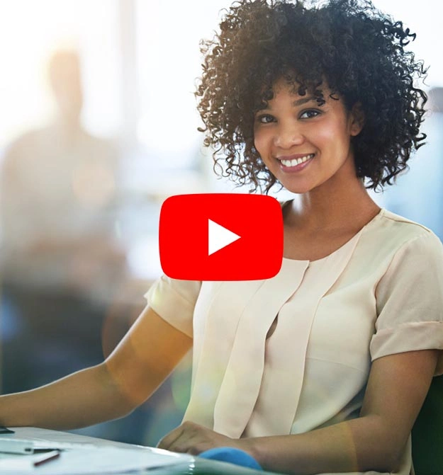 Women Smiling At Her Desk Emailing Batches Of Statements Using Zetadocs Collection Management Software