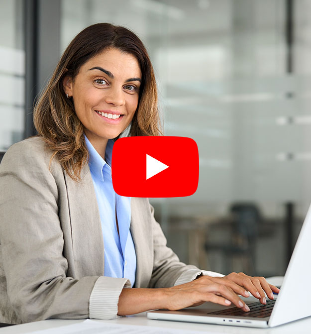 Lady At Desk Smiling While Using Journal Document Processing Solution From Zetadocs