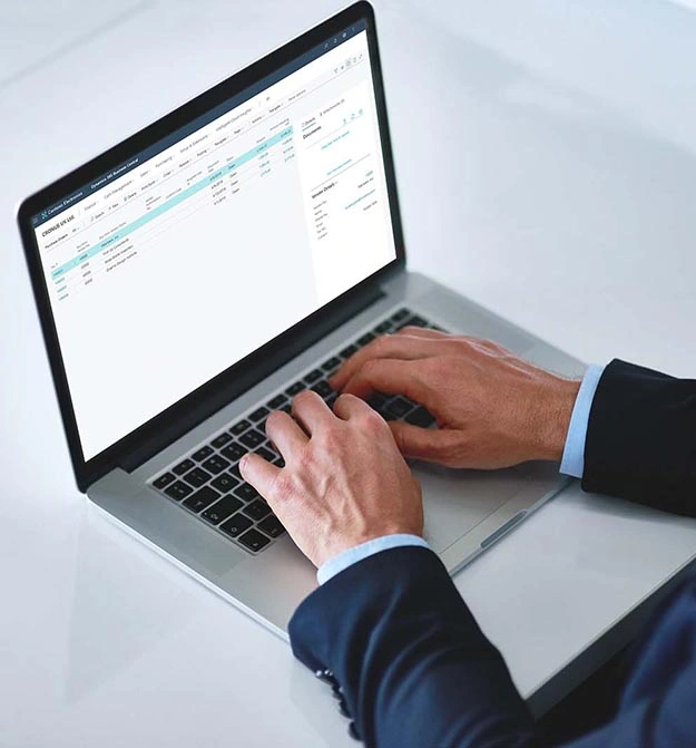 Male Using Zetadocs Expenses On Business Central On Laptop