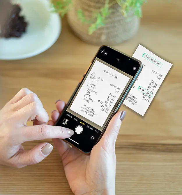 Person taking a photograph of receipt using the Zetadocs Expenses app