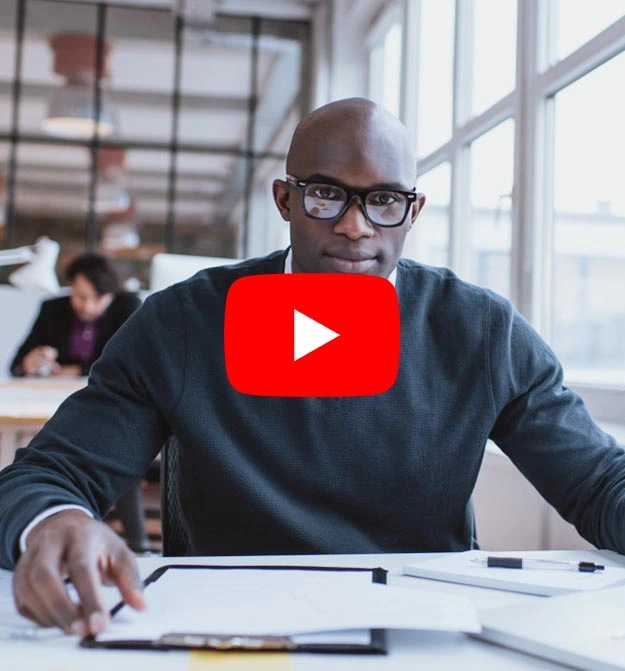 Man at desk, happy after using Zetadocs Capture on Business Central and NAV