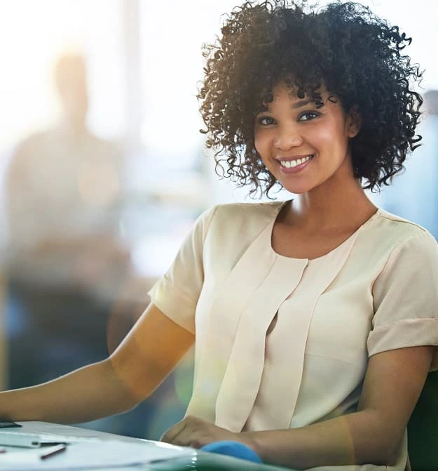 Women Smiling At Her Desk Emailing Batches Of Statements Using Business Central Collection Management Software
